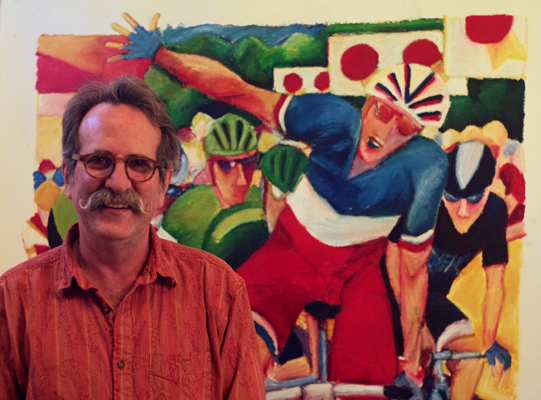 Greig Leach poses with an over-sized oil pastel drawing in his studio. Photo by the reviewer.